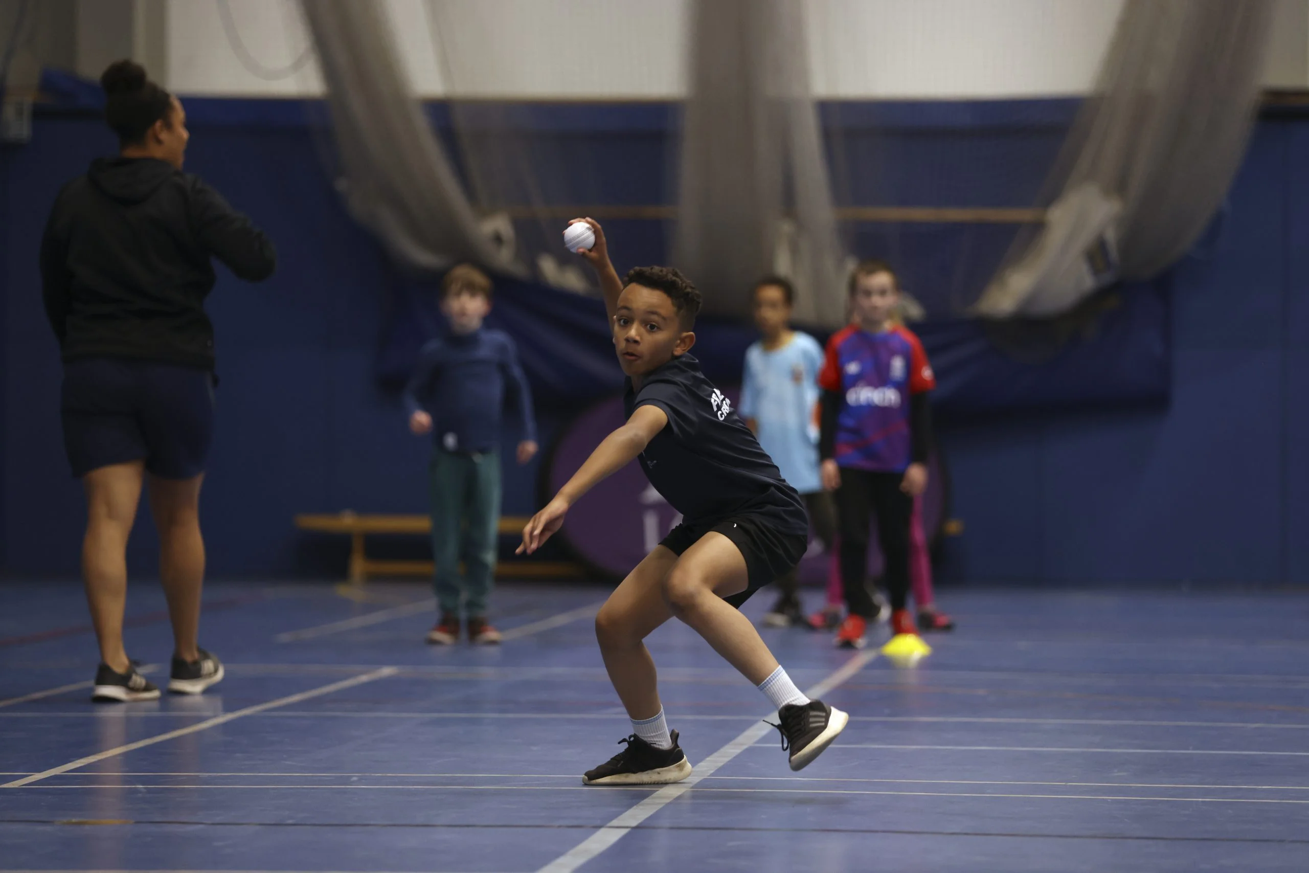 BRISTOL, ENGLAND. NOVEMBER 05, 2021; ACE coach Theo Gordon and  England Womens players, Sophia Dunkley, Katie George and Sarah Glenn takes a childrens training session at City Academy School in Bristol, England, on November 05, 2021.